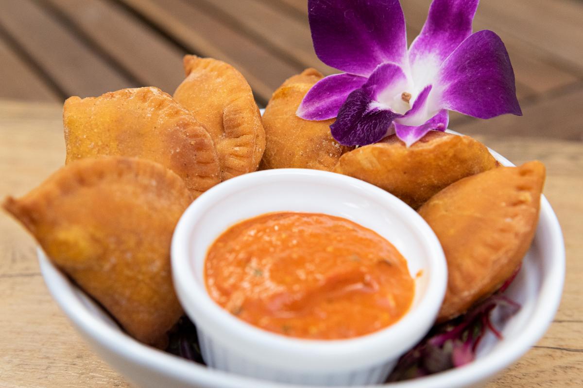 A Fried food item served with a special sauce